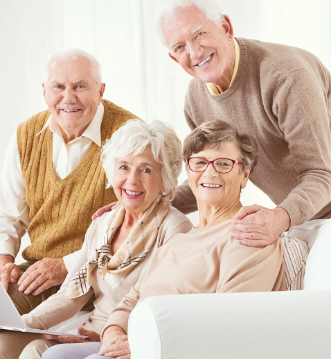 four seniors smiling